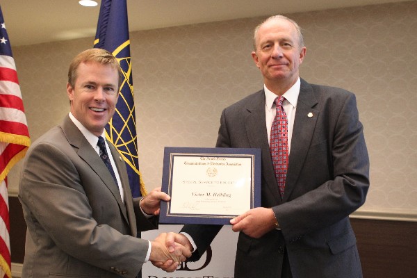 In October, Victor M. Helbling (r) receives a certificate of appreciation from Morrow on behalf of the AFCEA Educational Foundation in recognition of his outstanding service to education.